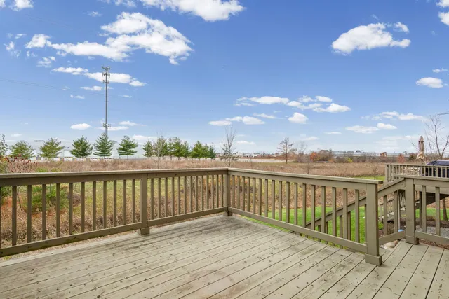 a view of a balcony with wooden floor