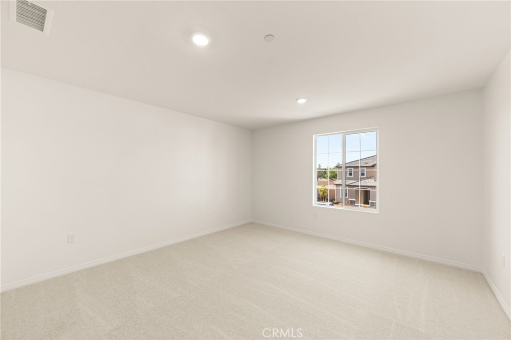 19434 Arenal Way Riverside, CA 92508 - Photo 11 of 25 an empty room with a window