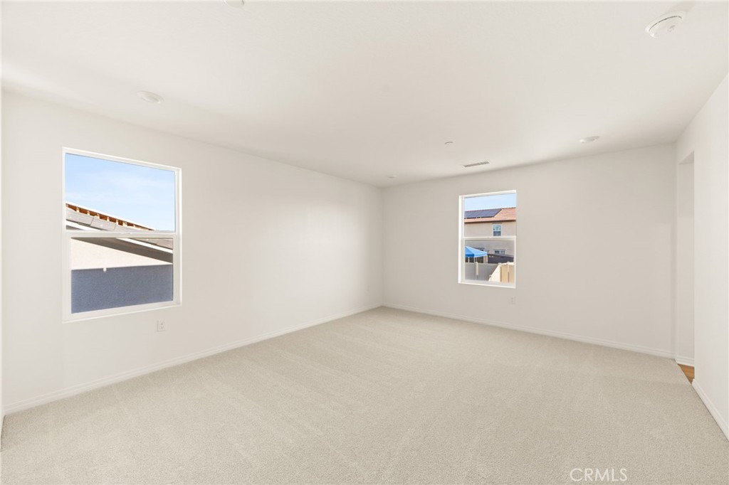 19434 Arenal Way Riverside, CA 92508 - Photo 12 of 25 an empty room with a window