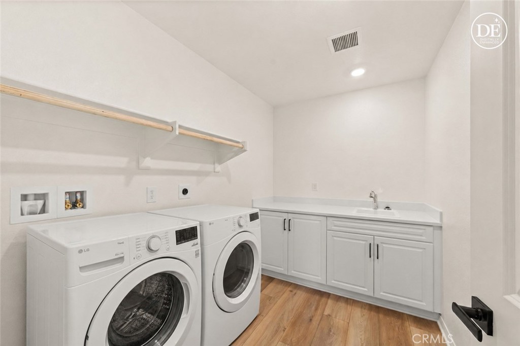 19434 Arenal Way Riverside, CA 92508 - Photo 15 of 25 a utility room with sink dryer and washer