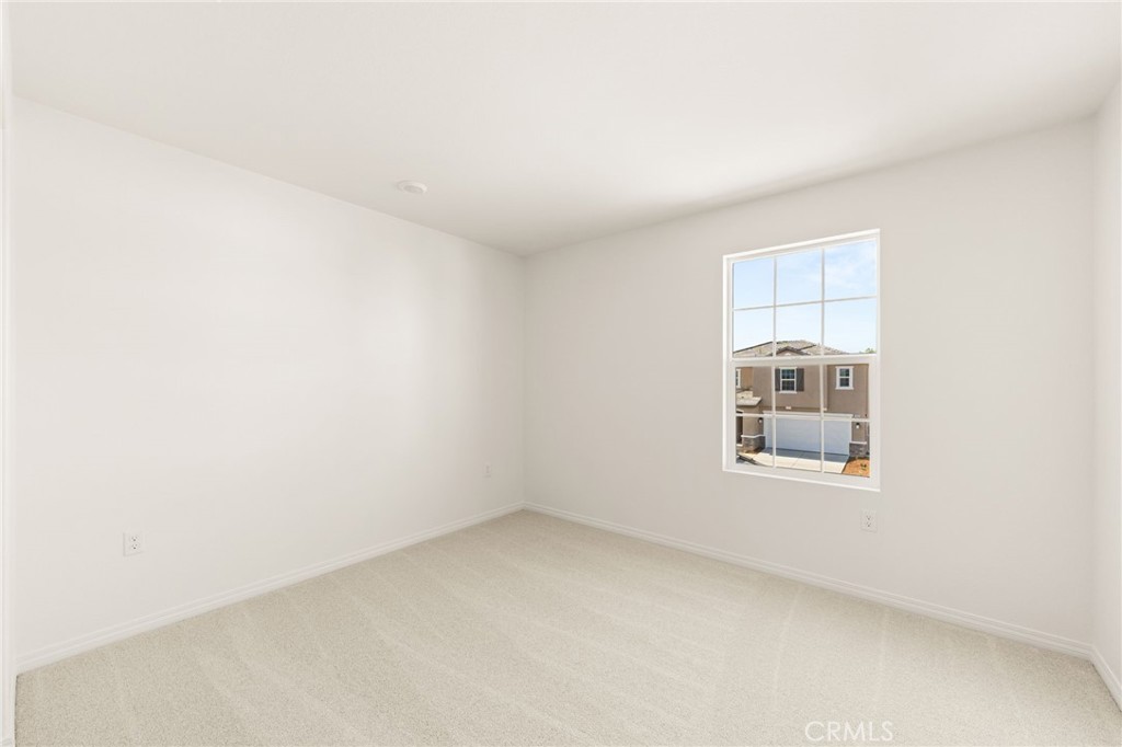 19434 Arenal Way Riverside, CA 92508 - Photo 20 of 25 an empty room with a window