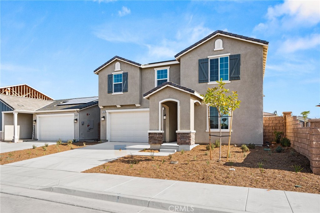 19434 Arenal Way Riverside, CA 92508 - Photo 2 of 25 a front view of a house with garden