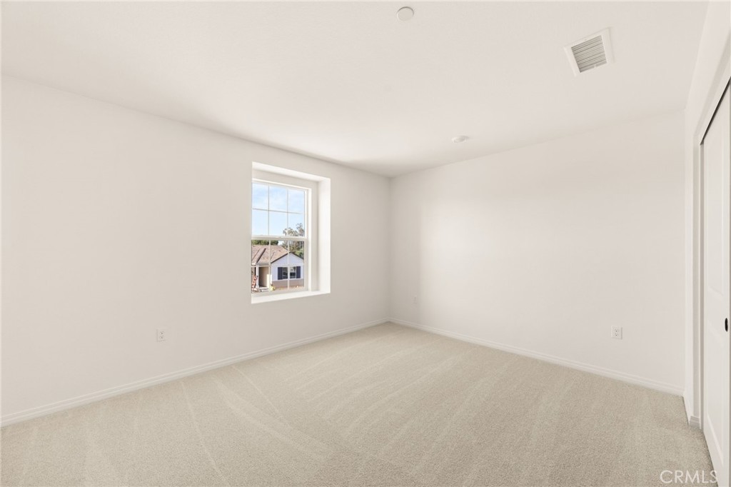 19434 Arenal Way Riverside, CA 92508 - Photo 21 of 25 an empty room with a window