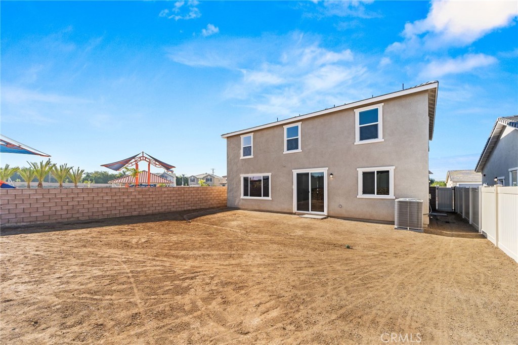 19434 Arenal Way Riverside, CA 92508 - Photo 22 of 25 a big room with table and chairs