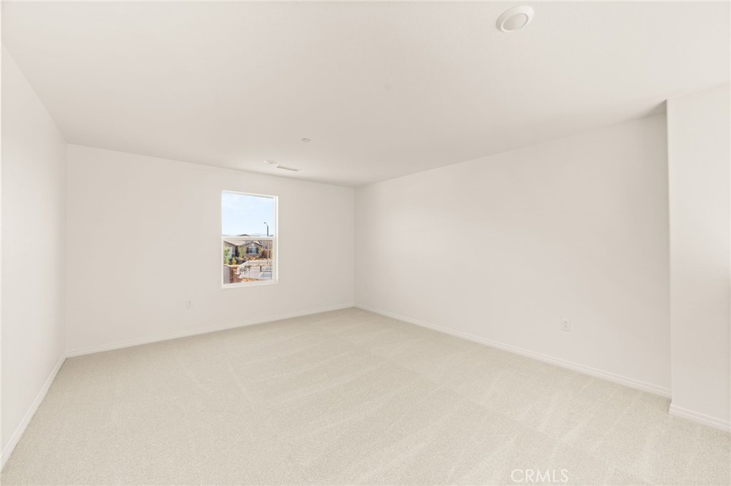 19434 Arenal Way Riverside, CA 92508 - Photo 9 of 25 an empty room with windows