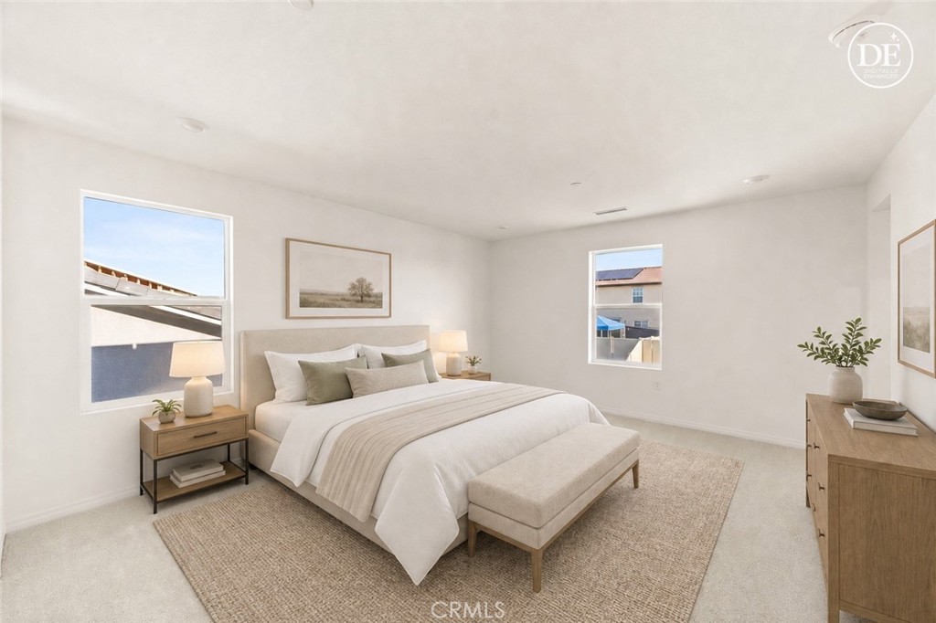 19434 Arenal Way Riverside, CA 92508 - Photo 10 of 25 a bedroom with a bed and a potted plant