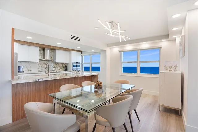 a dining room with furniture and wooden floor