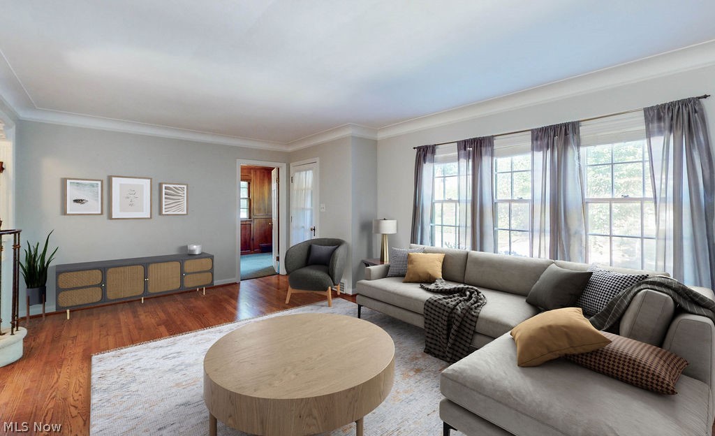 2555 Channing Road Cleveland, OH 44118 - Photo 2 of 24 Living room with walls of windows, ornamental molding and hardwood floors (virtually staged)