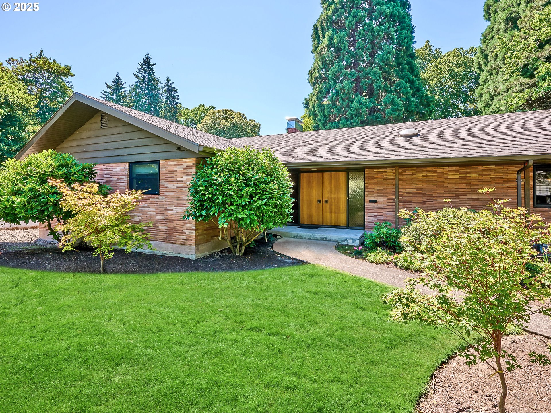 790 Southeast Webber Street, Unit 401 Portland, OR 97202 - Photo 1 of 43 front view of a house with a yard