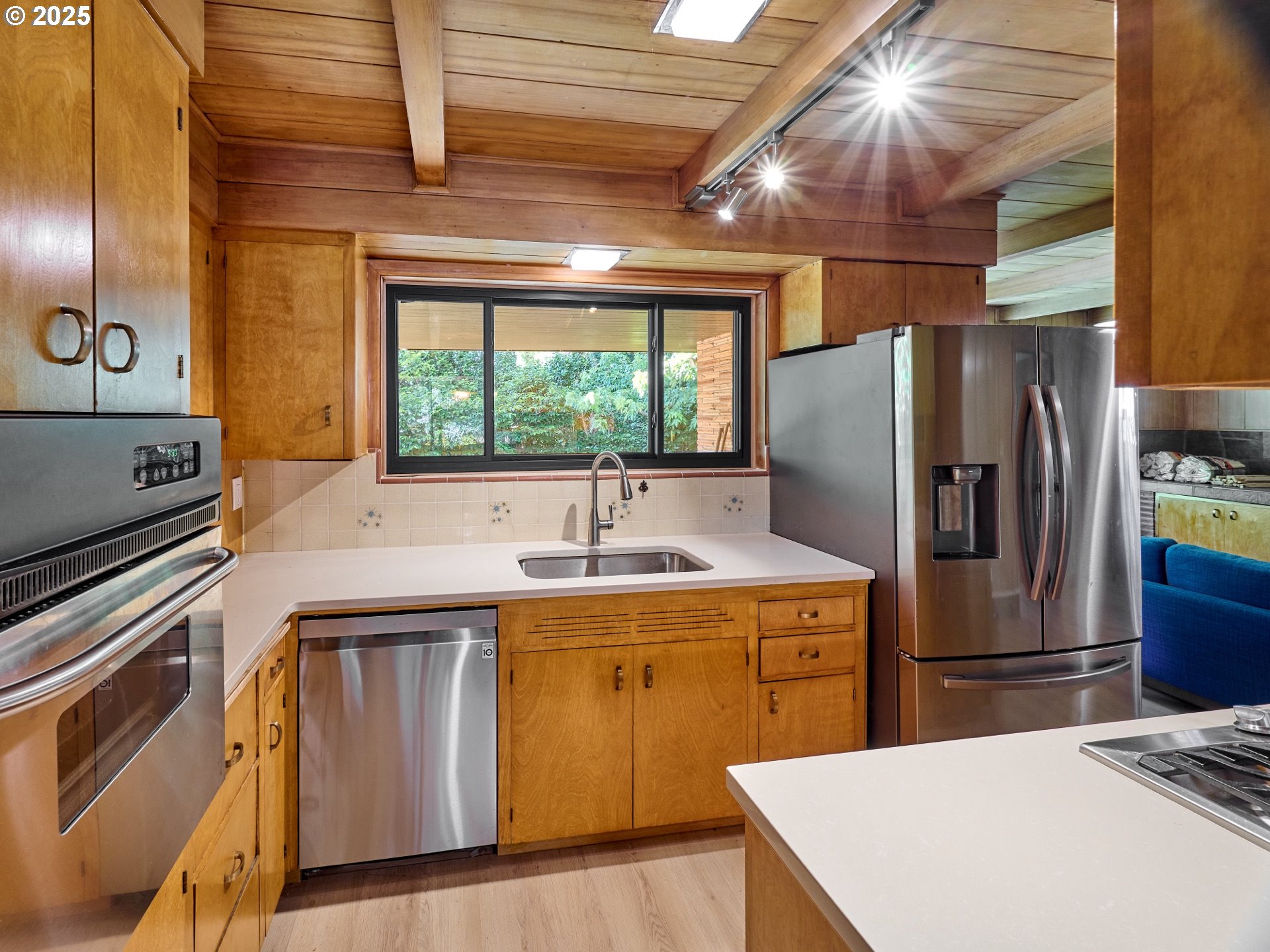 790 Southeast Webber Street, Unit 401 Portland, OR 97202 - Photo 15 of 43 a kitchen with a sink appliances and cabinets