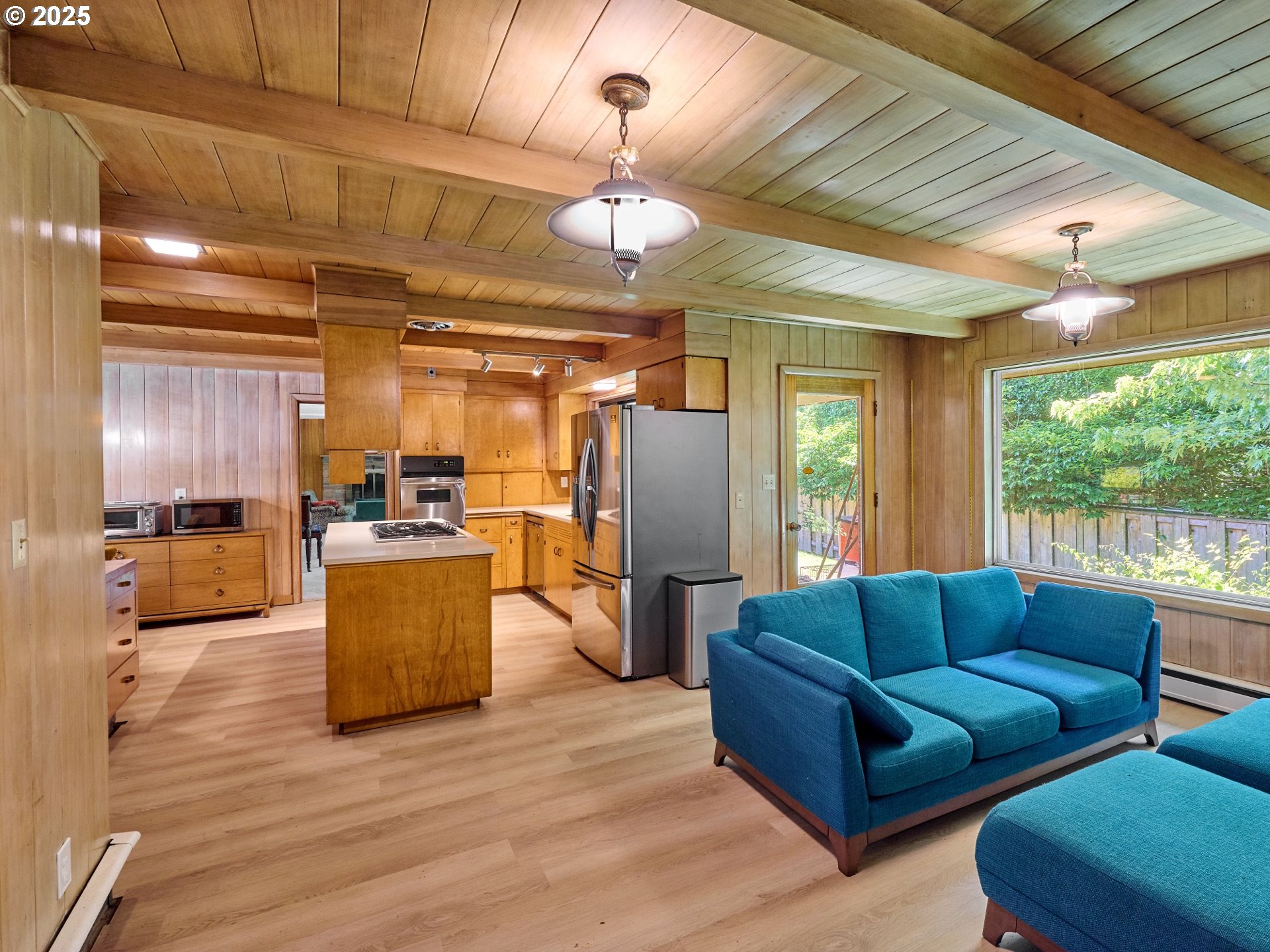 790 Southeast Webber Street, Unit 401 Portland, OR 97202 - Photo 17 of 43 a living room with furniture and a large window