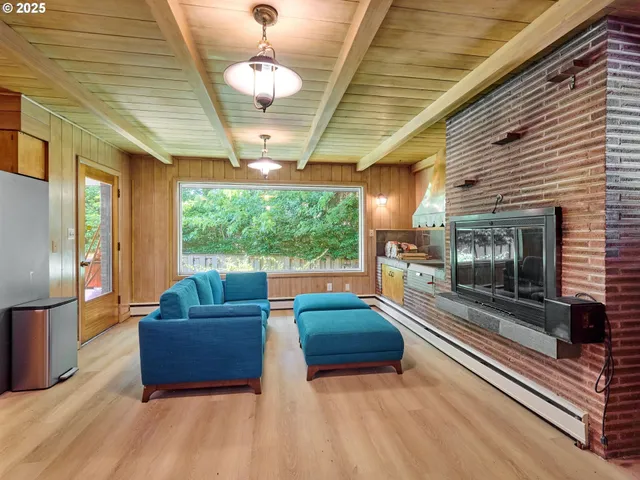 a living room with furniture fireplace and flat screen tv