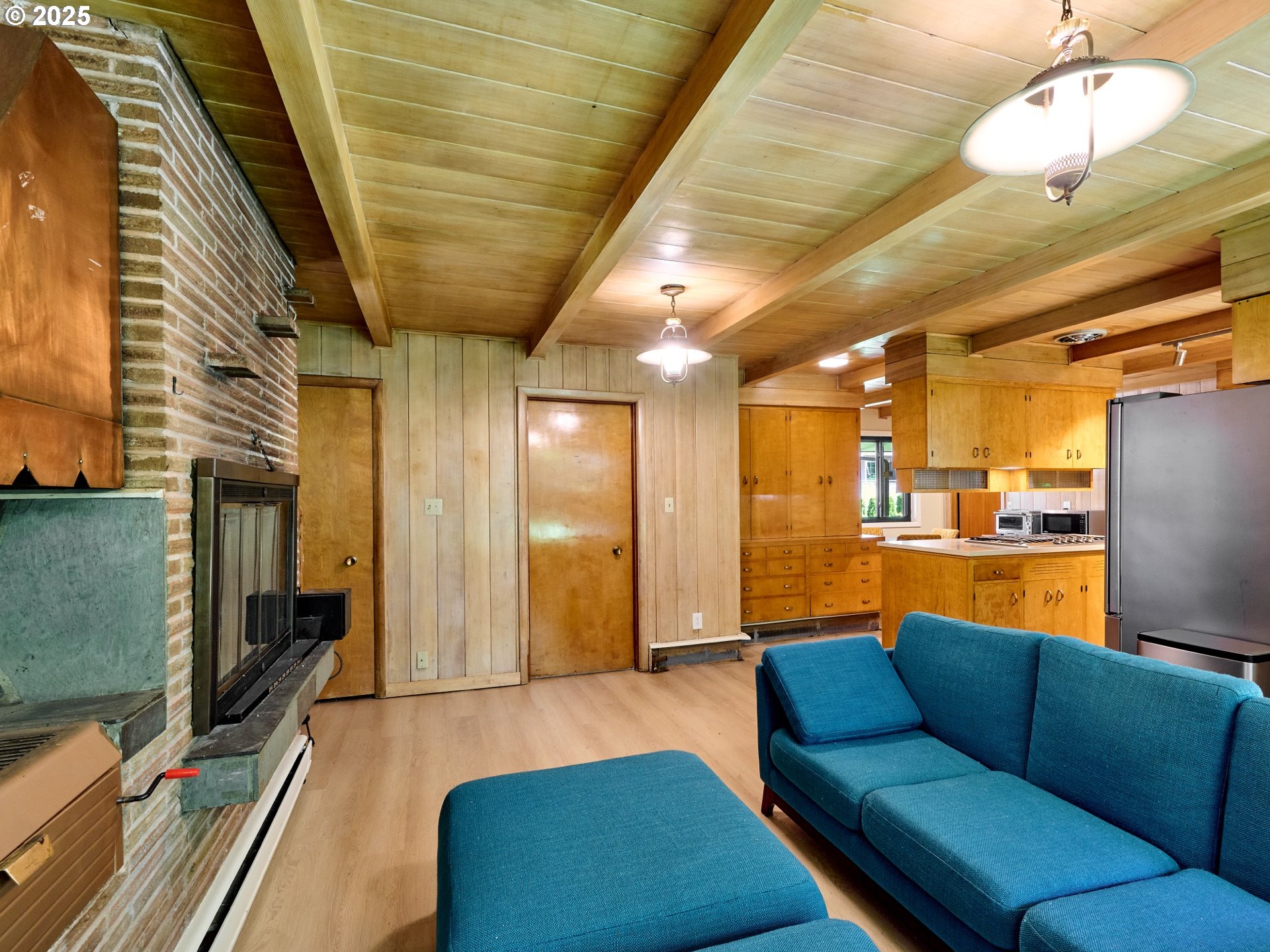 790 Southeast Webber Street, Unit 401 Portland, OR 97202 - Photo 20 of 43 a living room with stainless steel appliances kitchen island granite countertop furniture and a rug