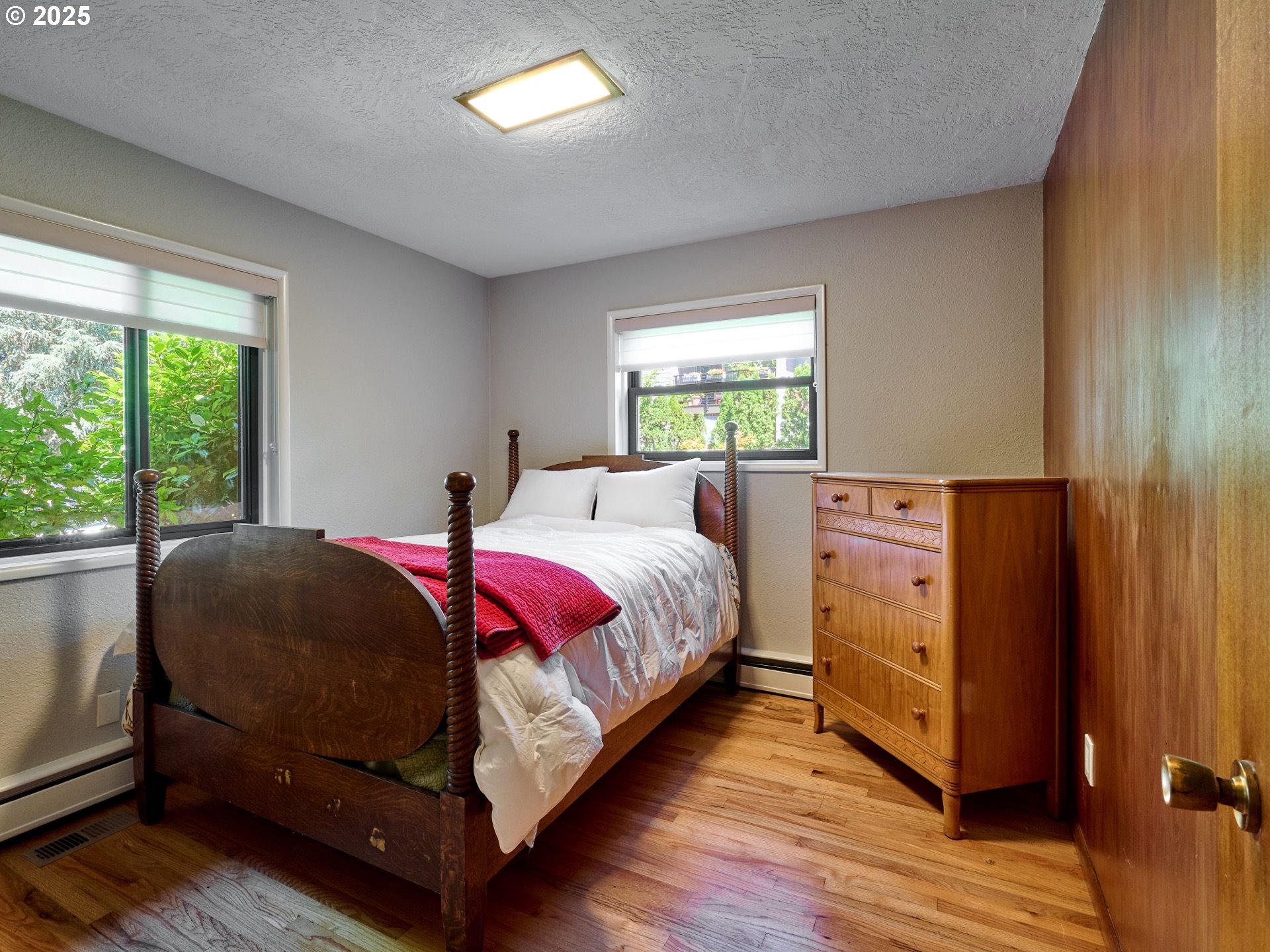 790 Southeast Webber Street, Unit 401 Portland, OR 97202 - Photo 26 of 43 a bed room with a bed and window