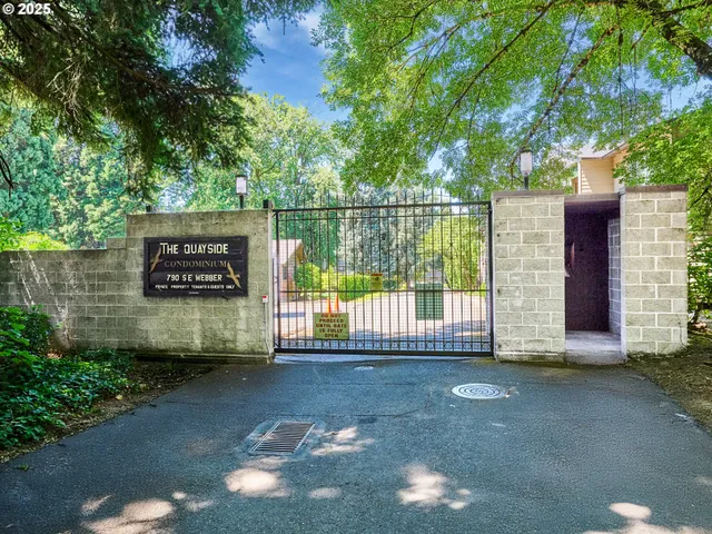 a view of a wooden fence and a bench