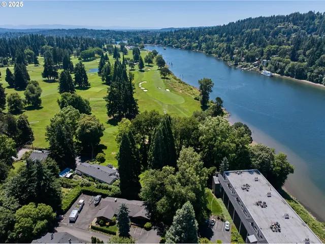 an aerial view of a houses with a yard