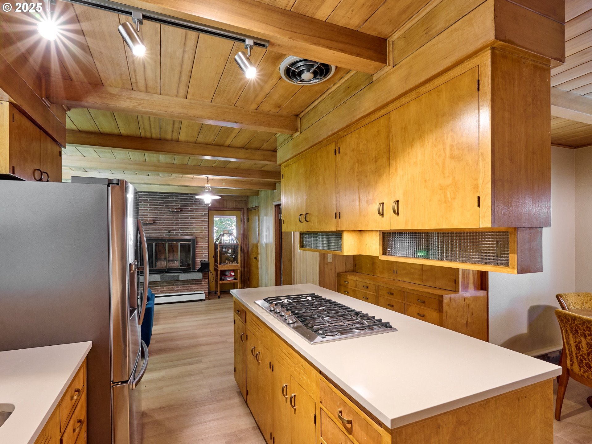 790 Southeast Webber Street, Unit 401 Portland, OR 97202 - Photo 10 of 43 a kitchen with stainless steel appliances granite countertop a sink a stove and a refrigerator