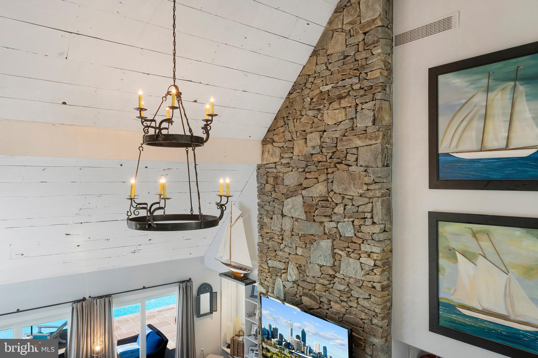 252 Riverside Road Edgewater, MD 21037 - Photo 35 of 90 Stacked stone FP and barn wood vaulted ceiling