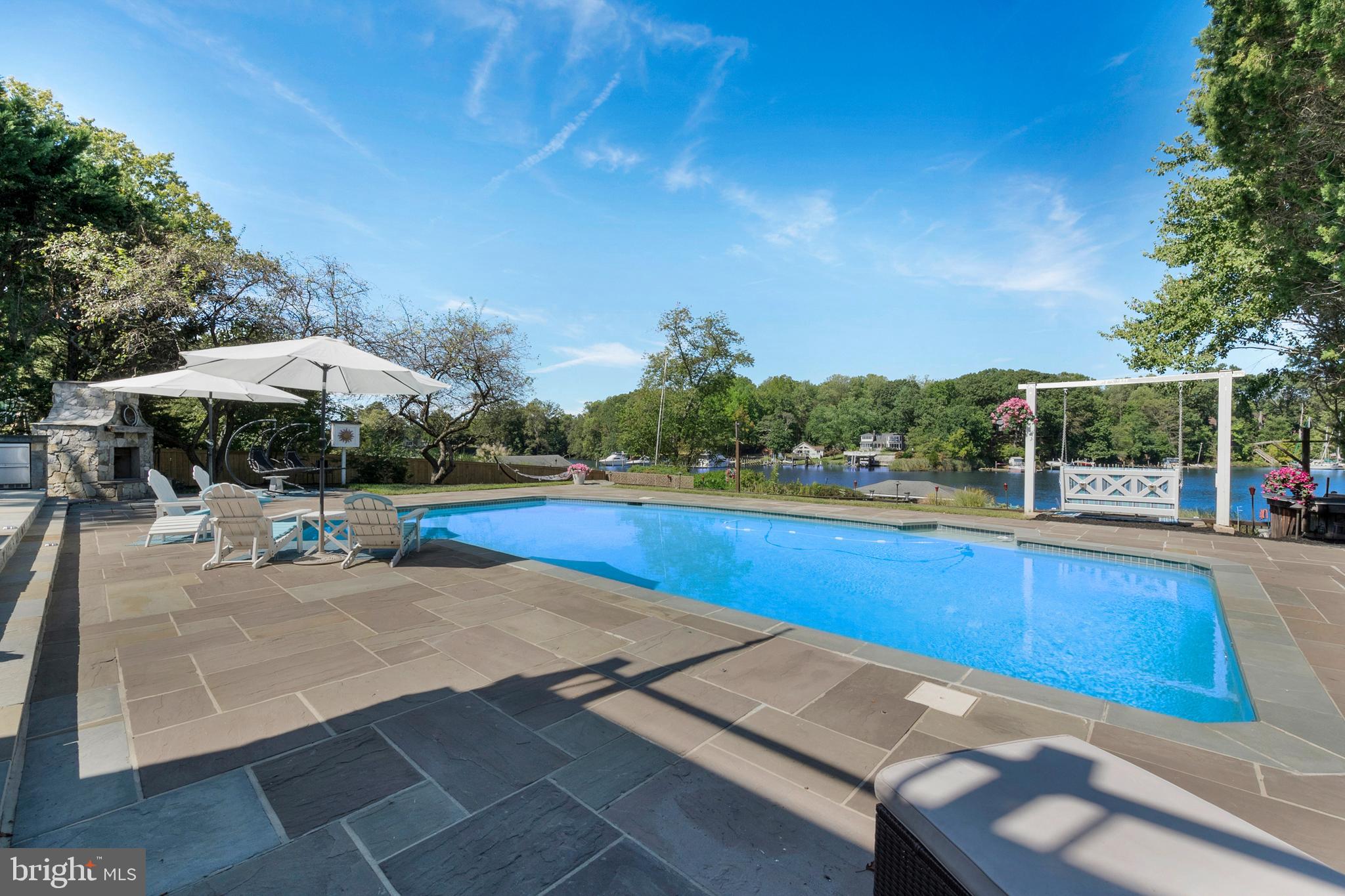 252 Riverside Road Edgewater, MD 21037 - Photo 64 of 90 Beautiful pool surrounded by flag stone