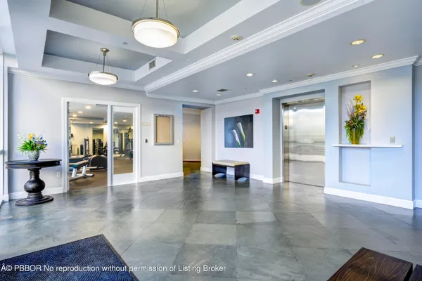 a view of a lobby with furniture and a table