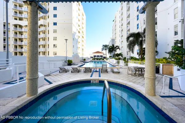 a view of swimming pool with outdoor seating