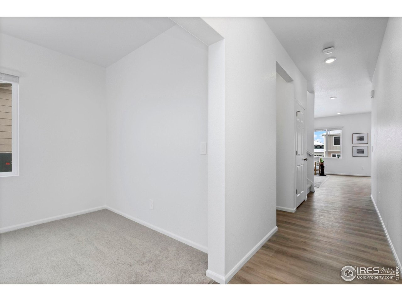 7339 27th St Lane Greeley, CO 80634 - Photo 12 of 32 a view of a room with wooden floor