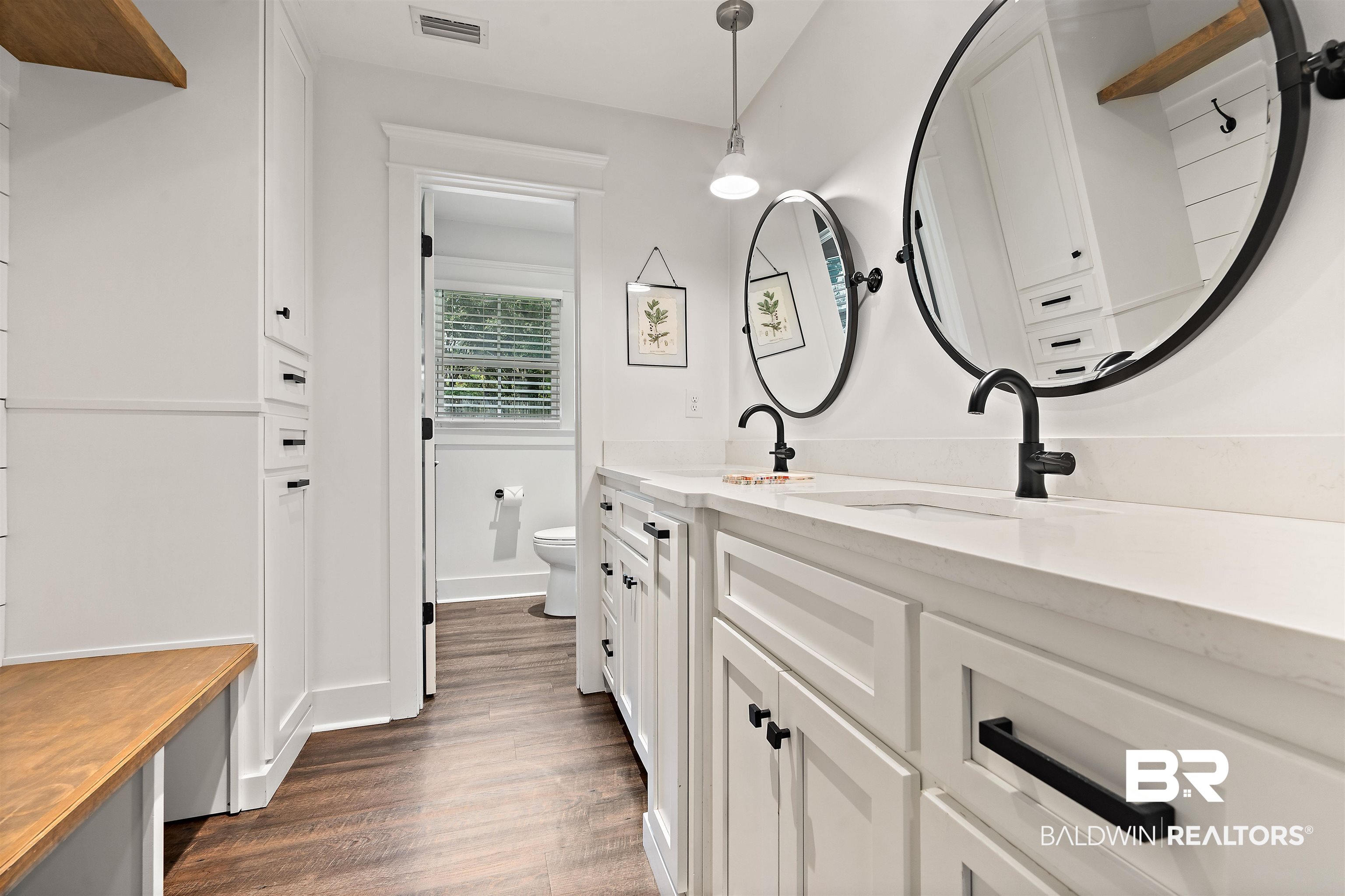 3808 Claridge Road North Mobile, AL 36608 - Photo 28 of 43 Bathroom featuring wood-type flooring, toilet, and vanity