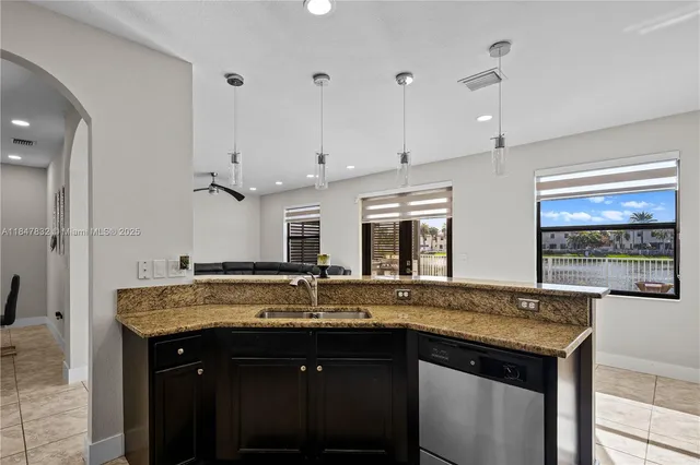 a bathroom with a double vanity sink mirror and shower