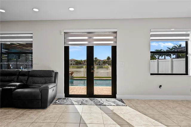 a bedroom with bed and a flat screen tv