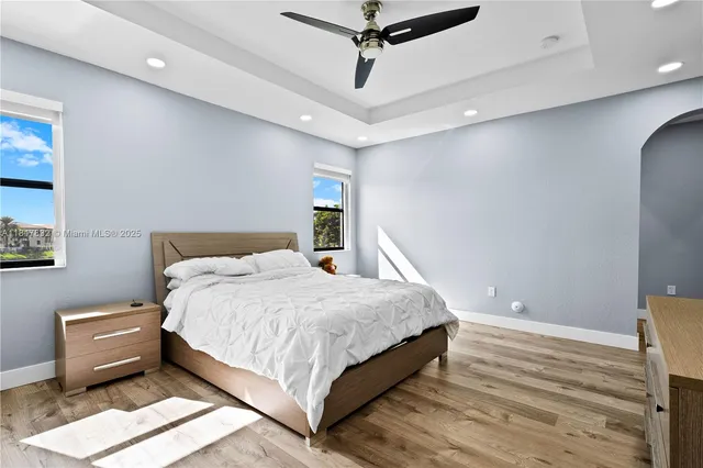 a bathroom with a toilet and a shower curtain