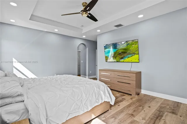 a close view of a sink a stove and a microwave oven in a room