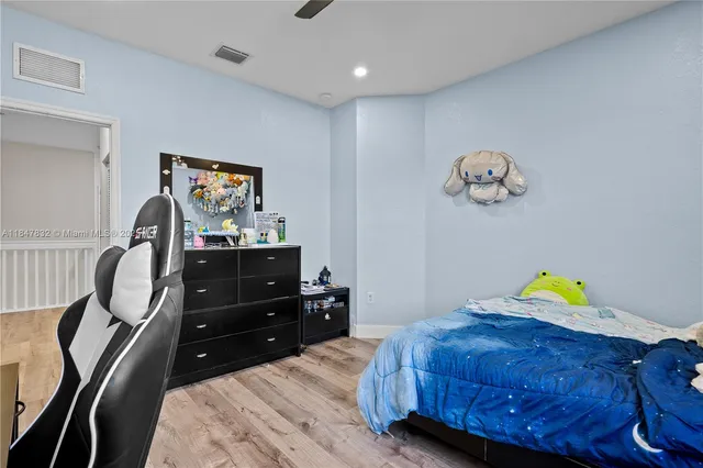 an aerial view of a house with a lake view