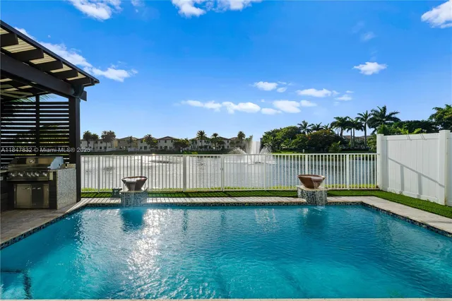 an aerial view of a house with a lake view