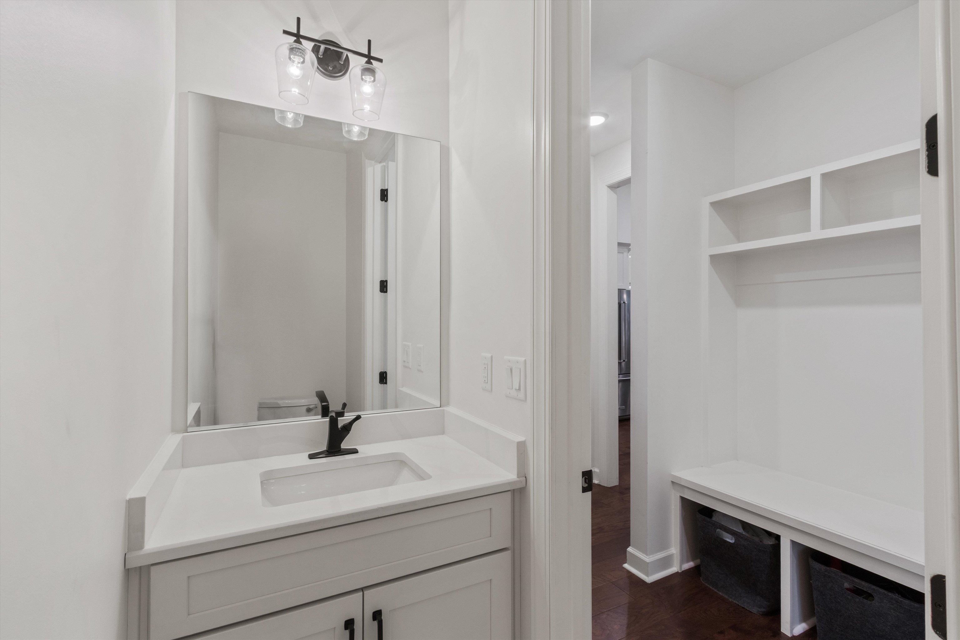 65 Watson Road Oakland, TN 38060 - Photo 27 of 40 a bathroom with a sink a toilet and a mirror