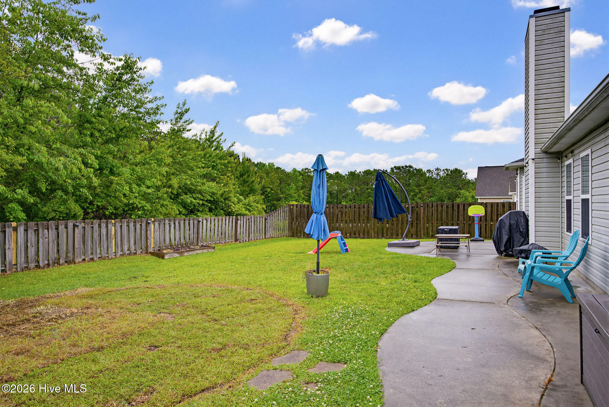 208 Red Carnation Drive Holly Ridge, NC 28445 - Photo 28 of 28 Fenced in backyard
