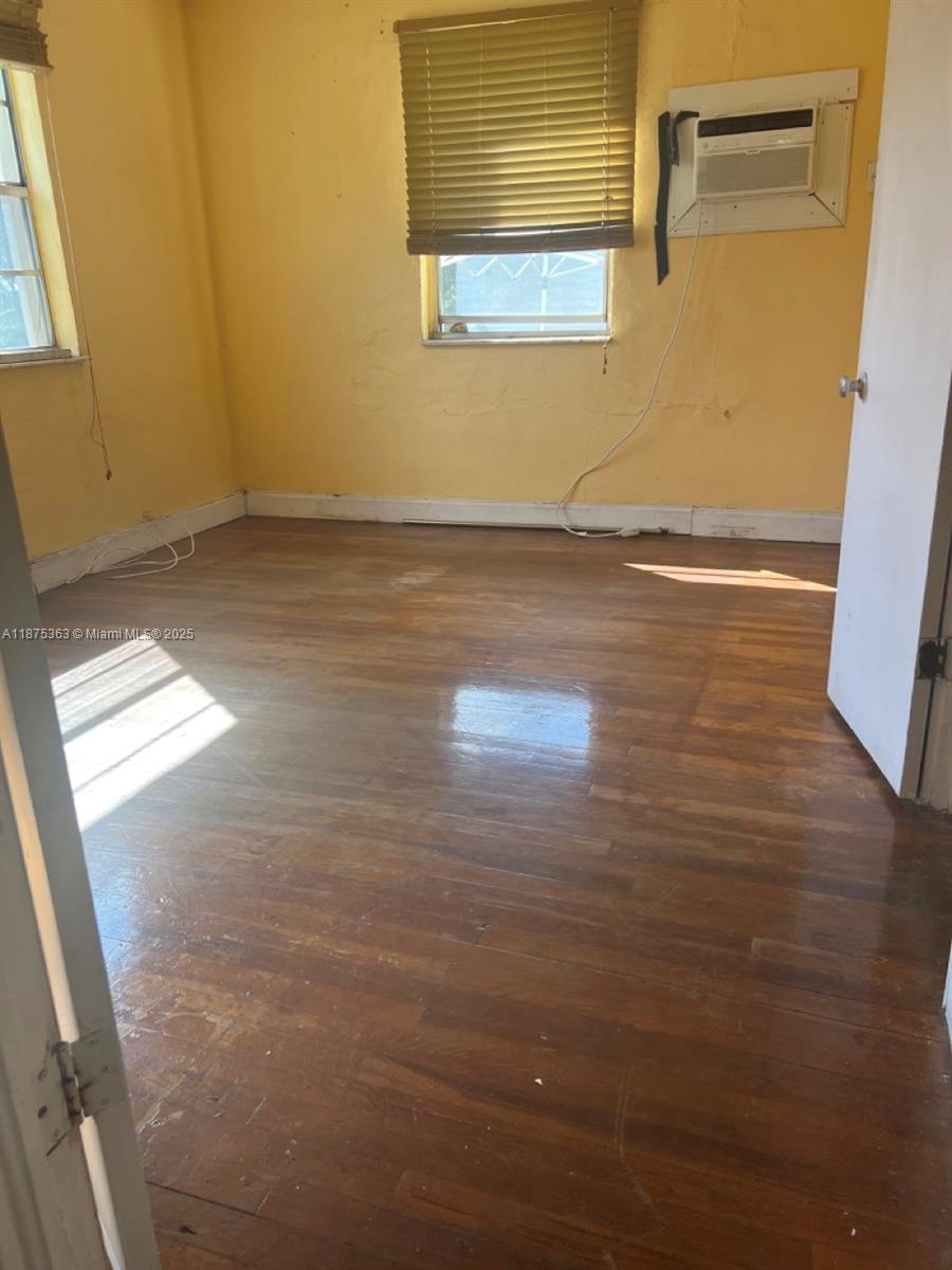 470 Northeast 130th Street North Miami, FL 33161 - Photo 14 of 21 a view of empty room with wooden floor