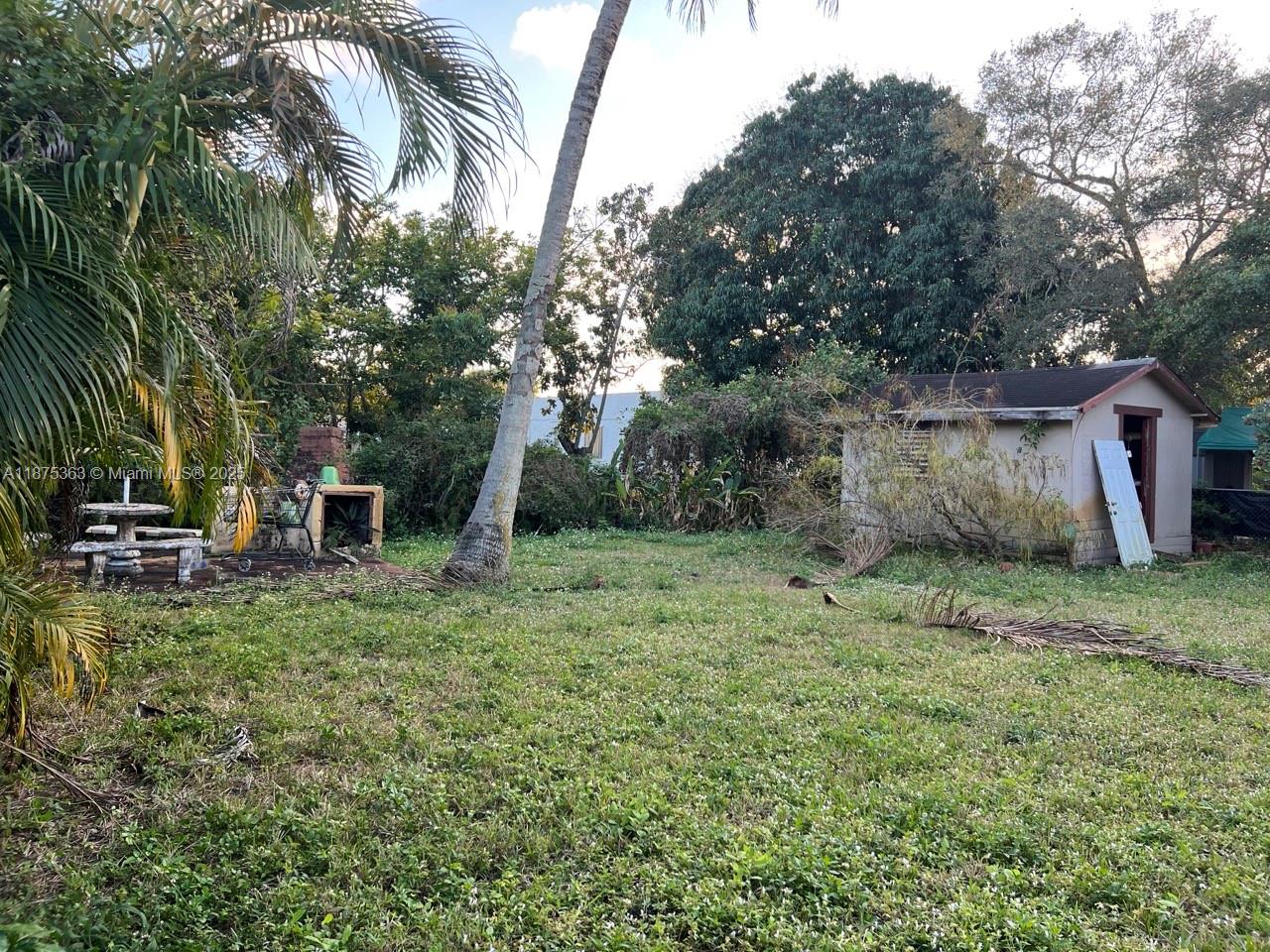 470 Northeast 130th Street North Miami, FL 33161 - Photo 21 of 21 a backyard of a house with lots of green space