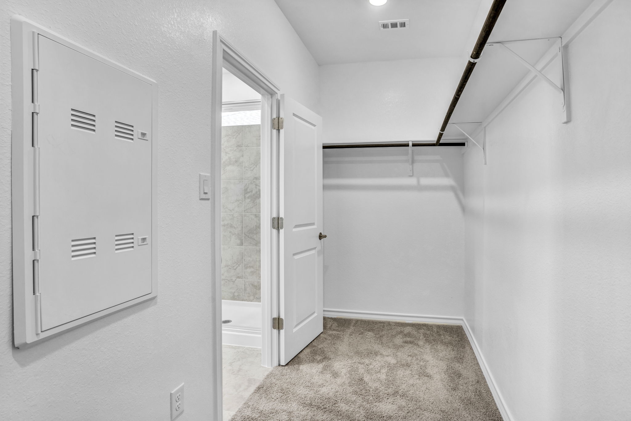 131 Adeline Road Hutto, TX 78634 - Photo 25 of 30 A well-organized closet offers ample storage space, ready for personalization.