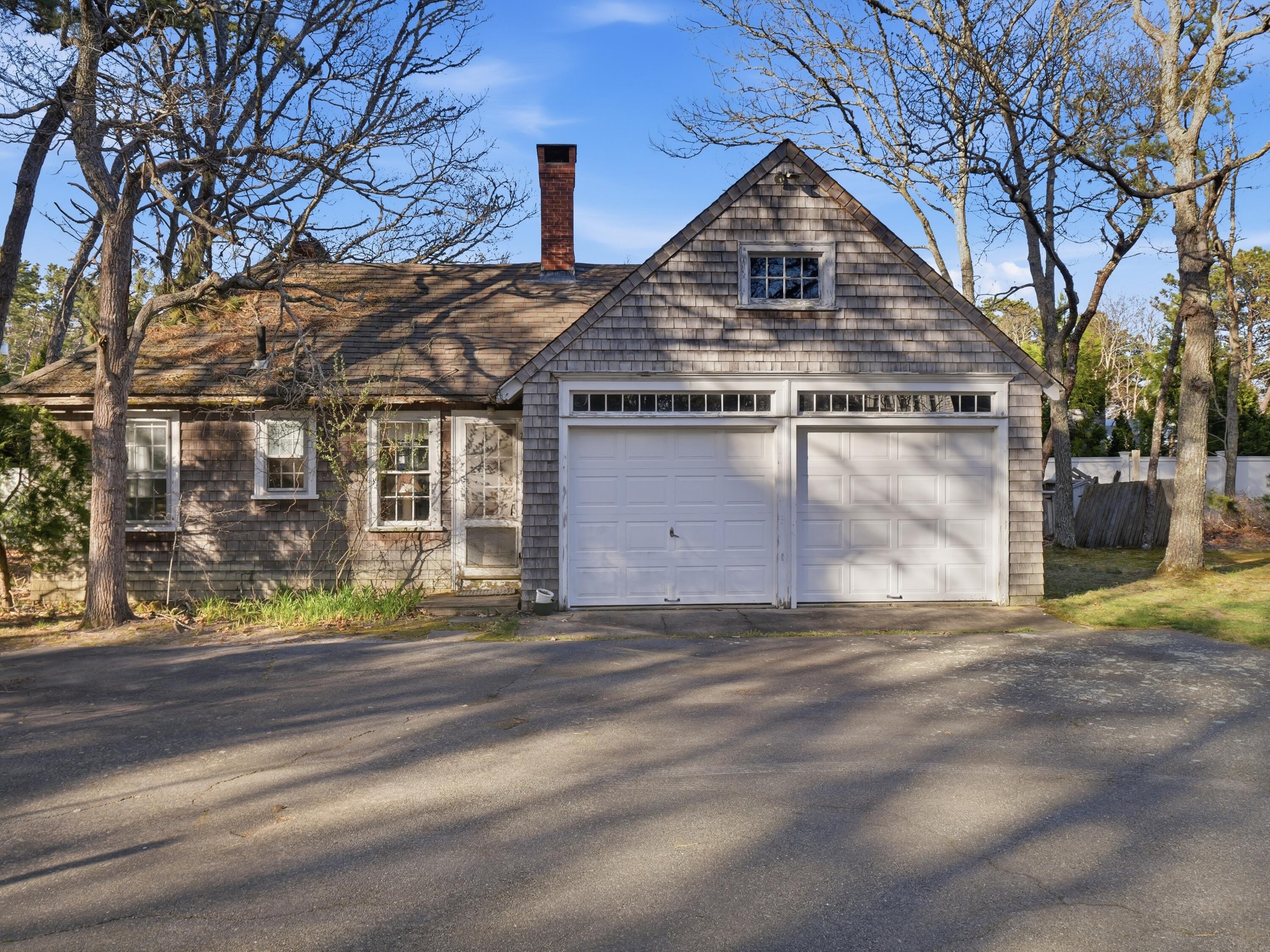 190 Vineyard Road Cotuit, MA 02635 - Photo 37 of 41 a front view of a house with a yard