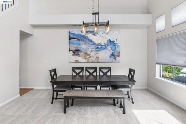 a bathroom with a sink a toilet and a large mirror