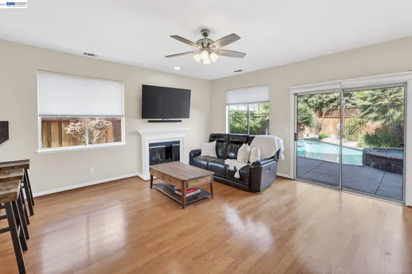 a backyard of a house with table and chairs