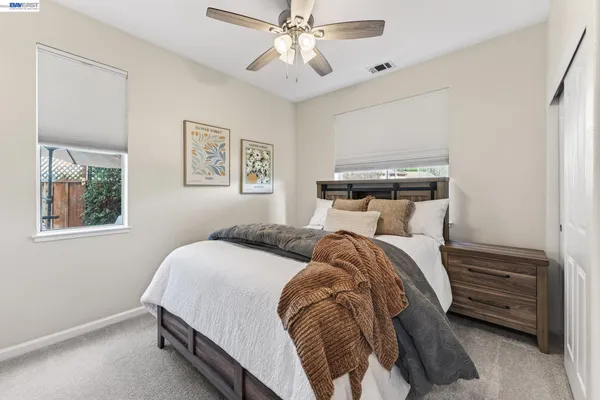 an aerial view of a house with a yard and large trees