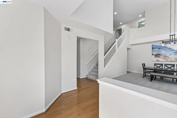 a view of a dining room with furniture and window