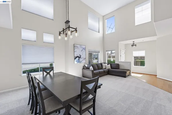 a large kitchen with stainless steel appliances granite countertop a sink and a stove