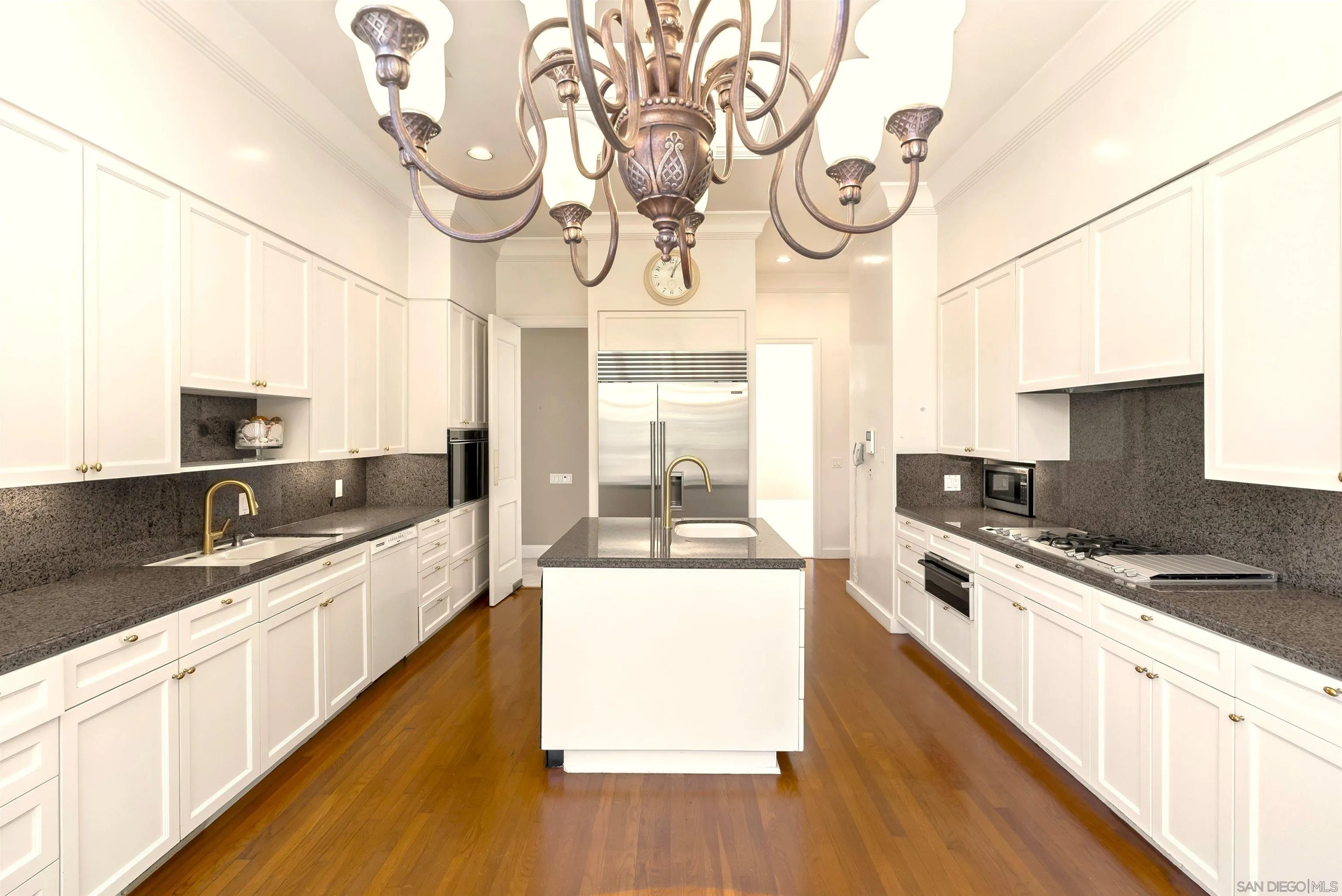 2302 Rue Adriane La Jolla, CA 92037 - Photo 8 of 31 a large kitchen with stainless steel appliances granite countertop a lot of counter space and wooden floor