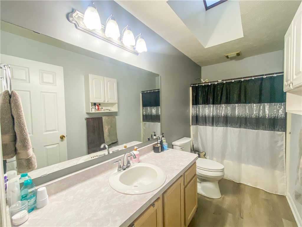 1026 Britton Road Greece, NY 14616 - Photo 13 of 29 bathroom w skylight