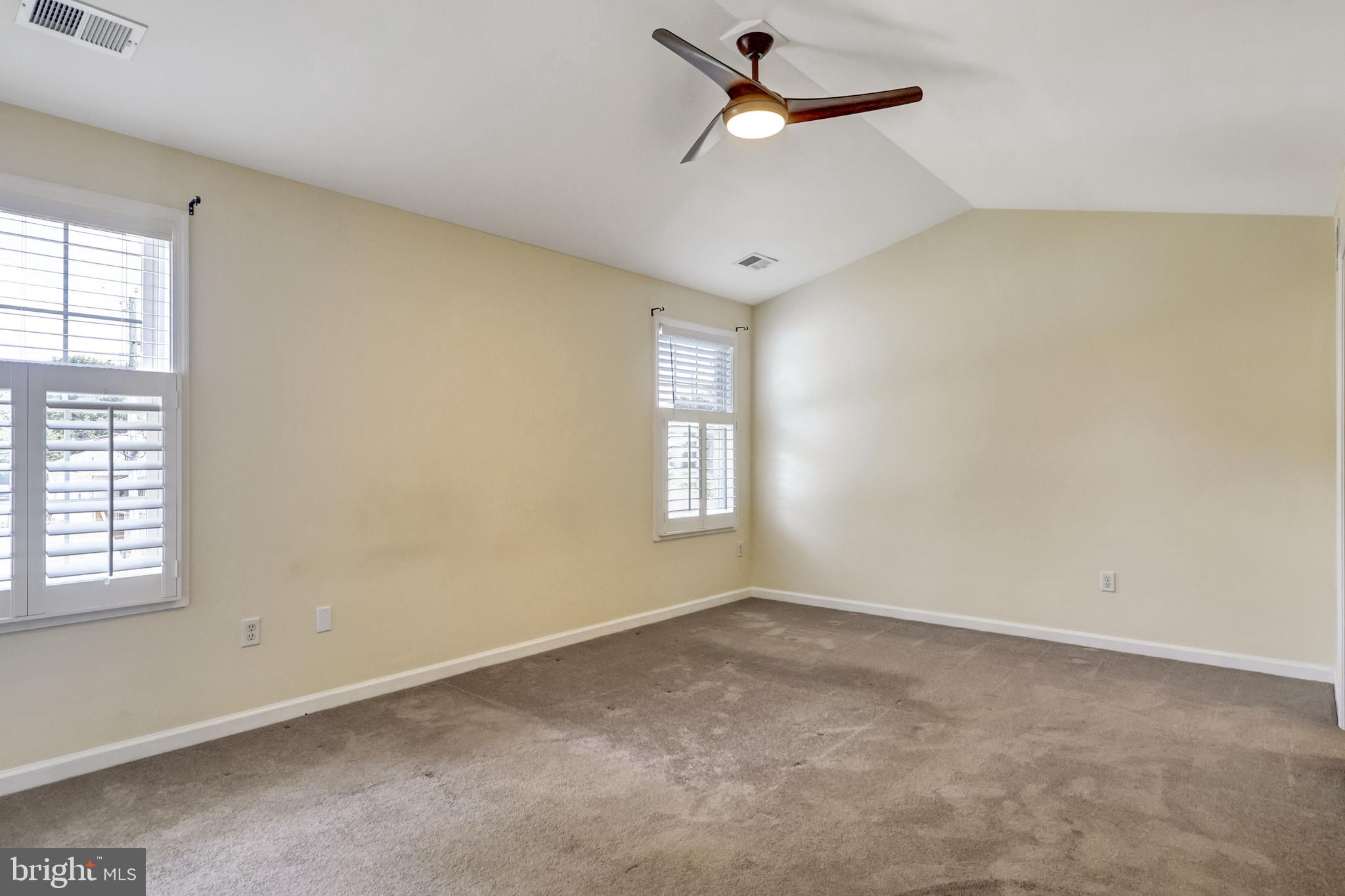 412 Shipley Road Linthicum Heights, MD 21090 - Photo 14 of 36 Owners suite has vaulted ceilings, shutters & fan.