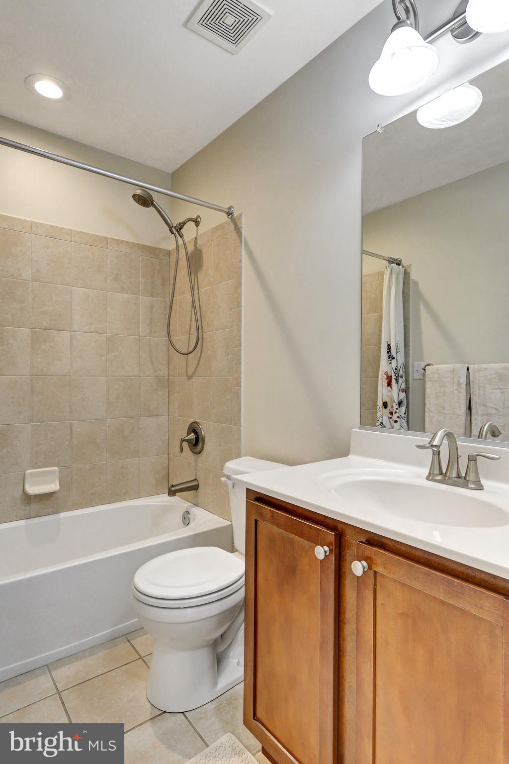 412 Shipley Road Linthicum Heights, MD 21090 - Photo 22 of 36 Hall bath with ceramic tub surround and floor.