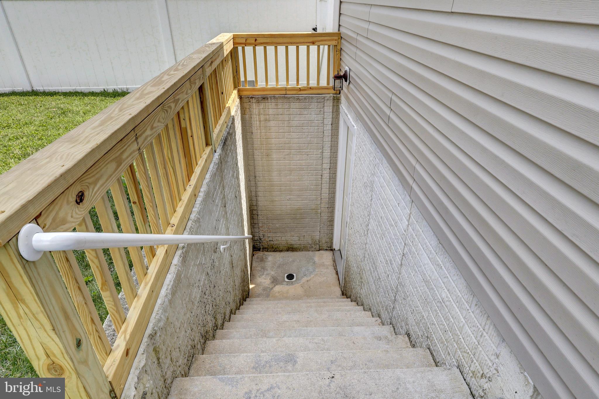 412 Shipley Road Linthicum Heights, MD 21090 - Photo 35 of 36 Areaway to basement with new safety railing.