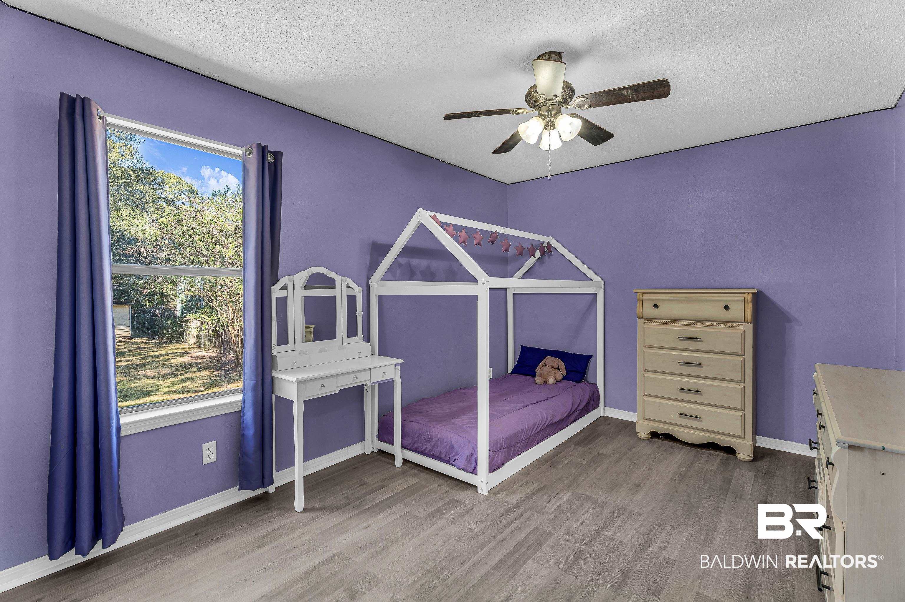 6135 Oak Cliff Drive Eight Mile, AL 36613 - Photo 22 of 30 Bedroom with light wood-type flooring, ceiling fan, and a textured ceiling